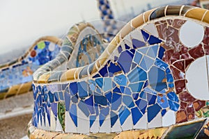 Detail of colorful mosaic work on the main terrace of Park Guell. Barcelona of Spain