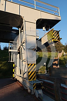 Detail of column of massive rail mounted gantry bridge crane, also called portal crane, with operator cabin visible