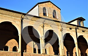 Detail with columns, of the upper part of the facade of a historic building in via Cesarotti in Padua, next to the Basilica del Sa