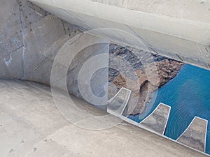 Detail of concrete dam wall and overflow of impressive Katse Dam hydroelectric power plant in Lesotho, Africa