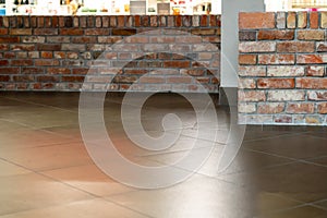 The detail of the corner baseboard on the wall and granite tiles on the floor. A white wall with a copy space, decorated with