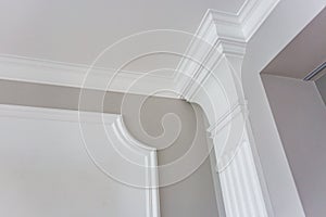 Detail of corner ceiling with intricate crown molding photo