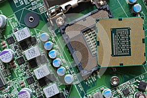 Detail of a CPU Processor over his Socket on a Motherboard. Printed Circuit Board - Computer Motherboard with Components. Close-up