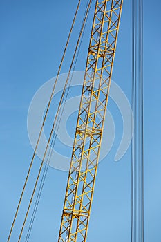 Detail crane jib against a blue sky