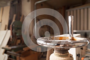 Detail of a crank in a carpenter workshop