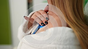 Detail cropped shot of unrecognizable young woman wearing holter monitor device for daily monitoring of an