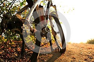 Detail of cyclist man feet riding mountain bike on outdoor