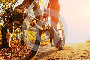 Detail of cyclist man feet riding mountain bike on outdoor