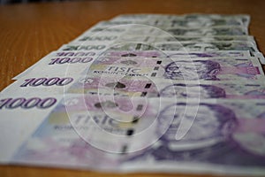 Detail of Czech bank notes (CZK, Crowns) in the nominal value of one and two thousand Czech Crowns