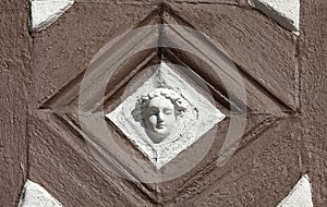 Detail of decorated facade with adages of an old half timbered house in old town of Miltenberg, Bavaria, Germany