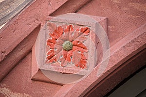 Detail of decorated facade of an old half timbered house in old town of Miltenberg, Germany