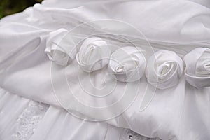 Detail of decorating white wedding dresses for the bride