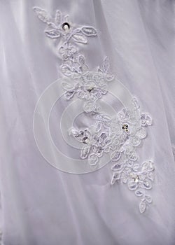 Detail of decorating white wedding dresses for the bride