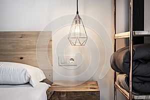 detail of the decoration of a bedroom with a bookshelf made of copper pipes,