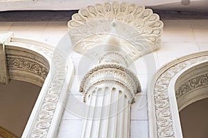 Detail of a decorative carved marble column in an Indian temple under construction