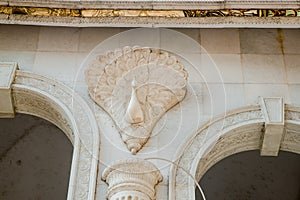 Detail of a decorative carved marble column in an Indian temple under construction