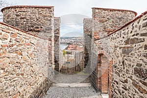 Detail of the defence system with a large watchtower and in the castle wall with embrasures of the fortress Feste Oberhaus near th