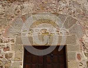 Detail of door and wall in SigÃ¼enza. Spain.