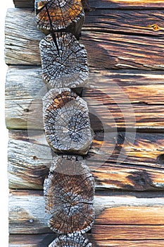 Detail of dovetail on traditional vintage wooden log cabin photo