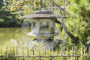 Detail of east garden with stone lantern and pond of Heian Jiungu Shrine in Kyoto, Japan.