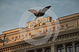 Detail of the effigy with Eagle located on the facade of the palace of the former military union Palazzo dell`Ex Unione Militare