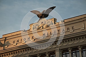 Detail of the effigy with Eagle located on the facade of the palace of the former military union Palazzo dell`Ex Unione Militare photo