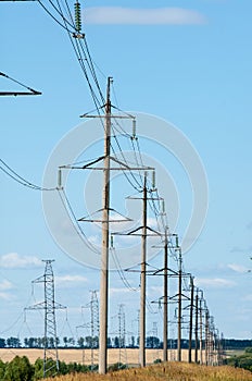 Detail of electricity pylon against blue sky