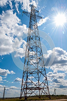 Detail of electricity pylon against blue sky