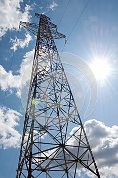 Detail of electricity pylon against blue sky