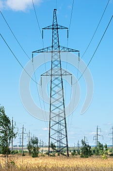 Detail of electricity pylon against blue sky