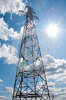 Detail of electricity pylon against blue sky