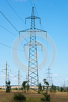 Detail of electricity pylon against blue sky