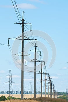 Detail of electricity pylon against blue sky