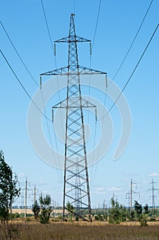 Detail of electricity pylon against blue sky