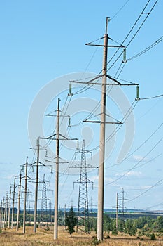 Detail of electricity pylon against blue sky