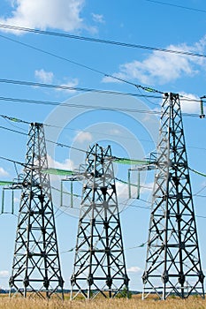 Detail of electricity pylon against blue sky