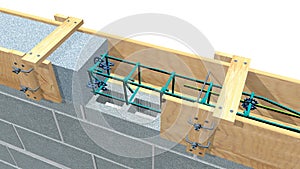 Detail of the elements of a concrete beam inside the wooden formwork on a wall of blocks.