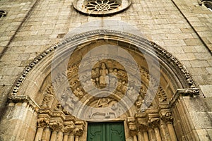 Detail of the entrance door of the church of Santa MarÃÂ­a de Azogue with a semicircular arch, archivolts and in the tympanum a photo