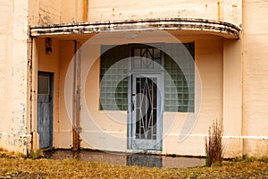 Entrance door in an old abandoned art deco building