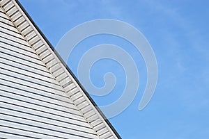 Detail of the exterior facade house roof trimmed siding