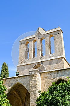 Detail of the facade of ancient Bellapais Abbey in Turkish Northern Cyprus taken with blue sky above. The historical Cypriot