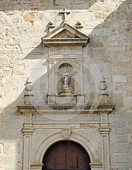 Detail of the facade of the church of El Palancar Convent in Pedroso de Acim, province of Caceres, Spain photo