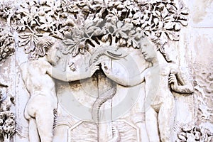 Detail of the facade of the Duomo of Orvieto, Italy. Marble bas-relief representing episodes of the bible. Adam and Eve