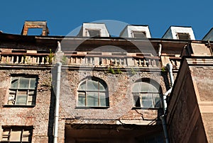 Detail of facade an house with burnt attics