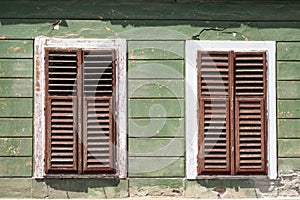 Detail of facade with old windows in rustic ancient house in Sibiu city,  Romania