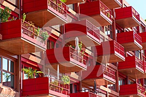 Detail of the facade of a red apartment house