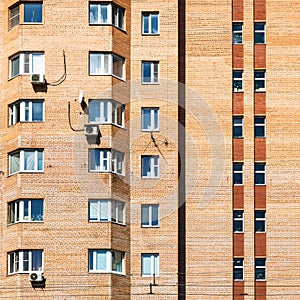 detail of facade of urban brick apartment building