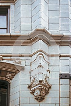 Detail of feature on outside of Art Deco building in Tulsa Oklahoma with ridges and door nearby