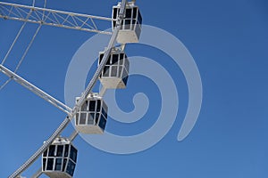 Detail of the Ferris wheel with blue sky in the background