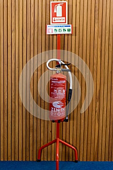 detail of a fire extinguisher installed inside a building.